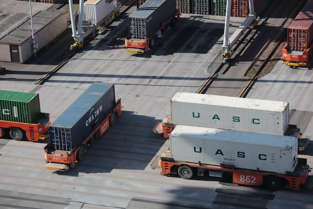 Shipping containers on logistic trucks